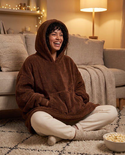 MAPLE hooded wearable blanket in Coffee, film night on the rug