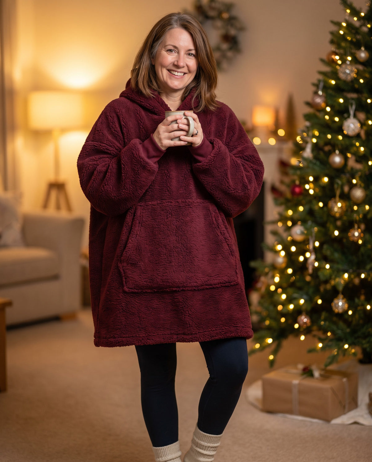 MAPLE hooded wearable blanket in Wine Red, by the Christmas tree